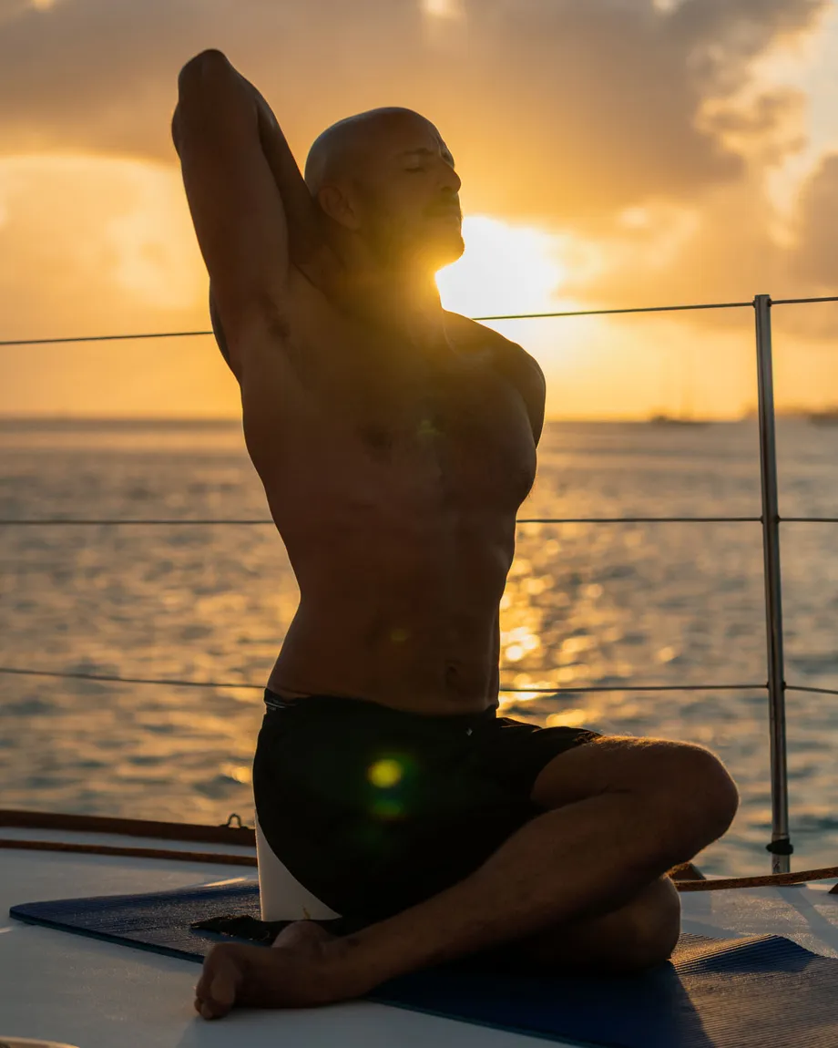 Yoga and breath at sunset on the deck of Ikigai, the sea beyond
